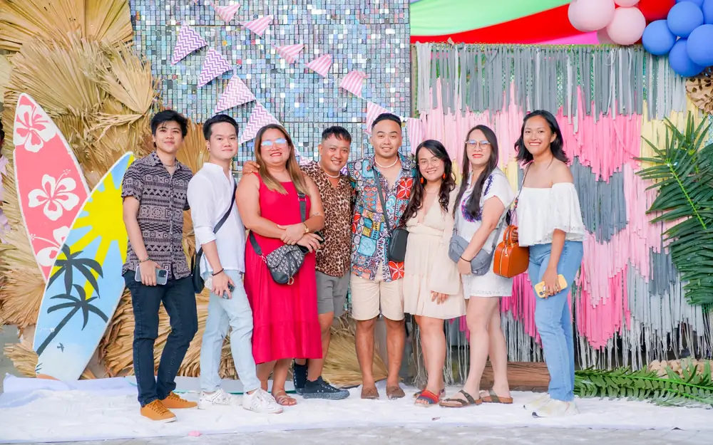 A group of ResolvedCX team members at the company event photo wall